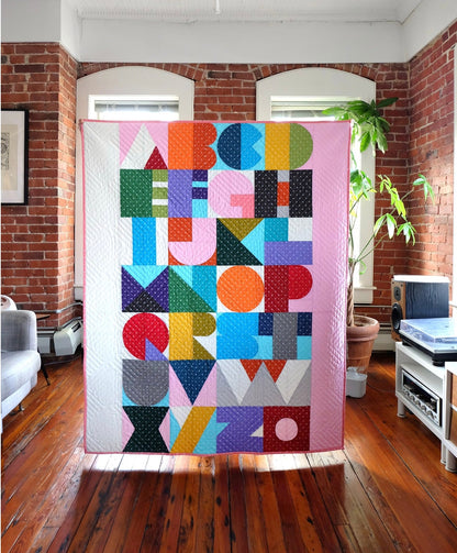 Bound Company Letra Quilt Pattern Finished Size: 44” x 56”