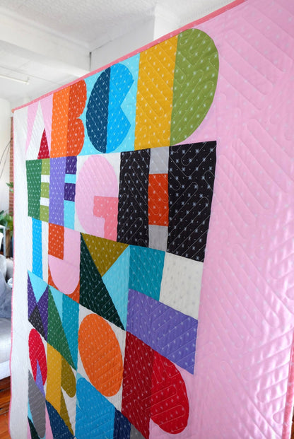 Bound Company Letra Quilt Pattern Finished Size: 44” x 56”
