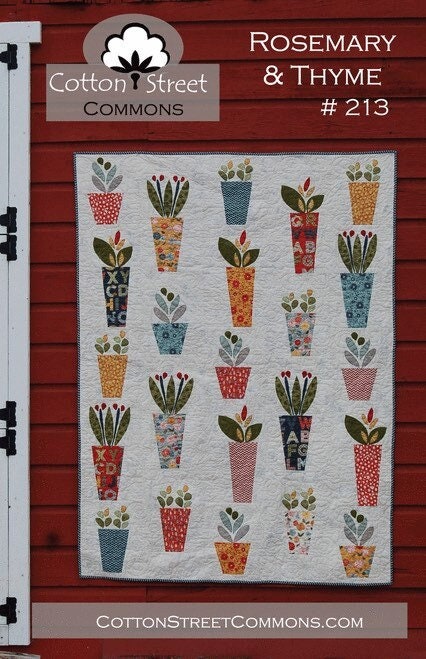May include: A white fabric with a quilt pattern of 20 colorful flower pots with green leaves. The fabric is labeled 'Cotton Street Commons' and 'Rosemary & Thyme #213'.