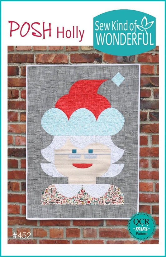 May include: A red and white Christmas quilt block with a gray background. The block features a stylized image of a woman wearing a red hat and a white fur trim. The quilt block is framed with a white border. The text 'POSH Holly' is in the top left corner of the image. The text 'Sew Kind of WONDERFUL' is in the top right corner of the image. The text '#452' is in the bottom left corner of the image. The text 'QCR -mini- Pattern' is in the bottom right corner of t