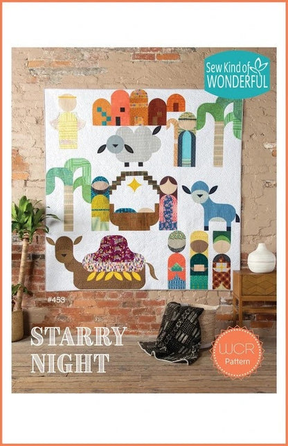 May include: A quilt pattern featuring a modern geometric nativity scene with a camel, sheep, and palm trees. The quilt is displayed on a brick wall with the words 'Sew Kind of WONDERFUL' and '#453' and 'STARRY NIGHT' and 'WCR Pattern' printed below the quilt.