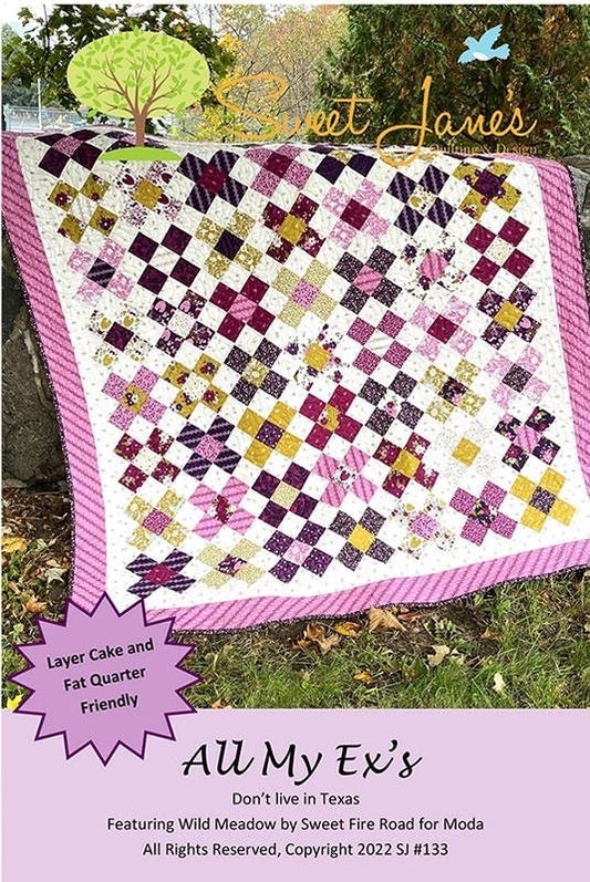 May include: A quilt pattern called "All My Ex's" featuring a patchwork design with purple, pink, white, and gold fabrics. The quilt is made with layer cake and fat quarter friendly fabrics. The pattern is by Sweet Jane's Quilting and Design.